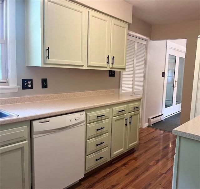 kitchen with light countertops, dark wood finished floors, dishwasher, and baseboard heating