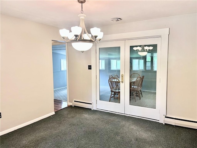unfurnished dining area featuring a baseboard heating unit, a healthy amount of sunlight, french doors, and an inviting chandelier