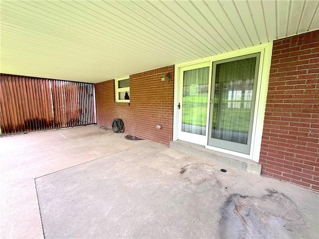 view of patio / terrace featuring an attached carport