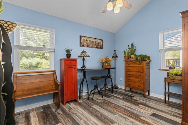 sitting room with dark wood-type flooring, baseboards, ceiling fan, and vaulted ceiling