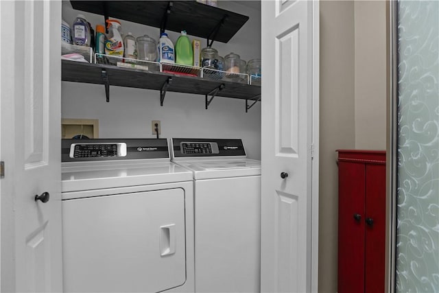 clothes washing area featuring laundry area and washing machine and dryer