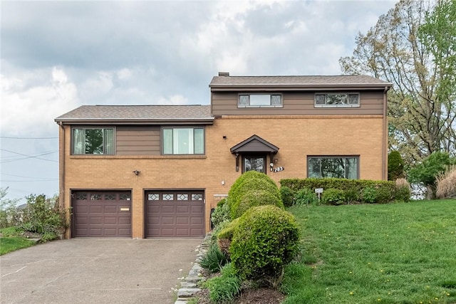 view of front facade featuring an attached garage, a chimney, driveway, and brick siding