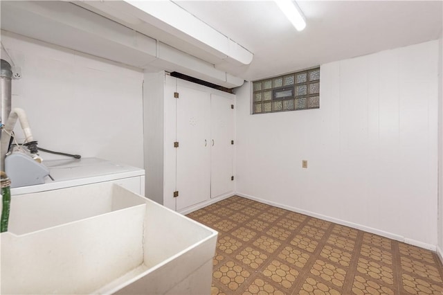 clothes washing area featuring laundry area, tile patterned floors, and washing machine and dryer