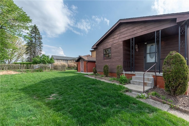 exterior space featuring an outbuilding, a yard, and a shed