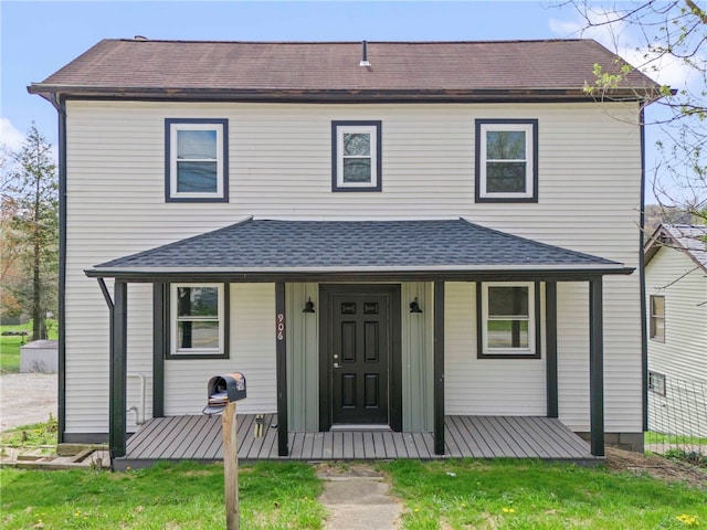 view of front of property with roof with shingles and covered porch