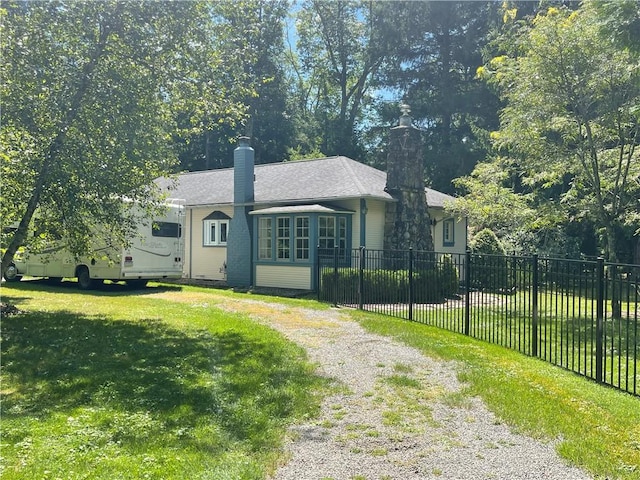 171 Mohawk Trl, Slippery Rock Twp But, PA 16057 - bungalow-style home featuring fence, a chimney, driveway, and a front lawn