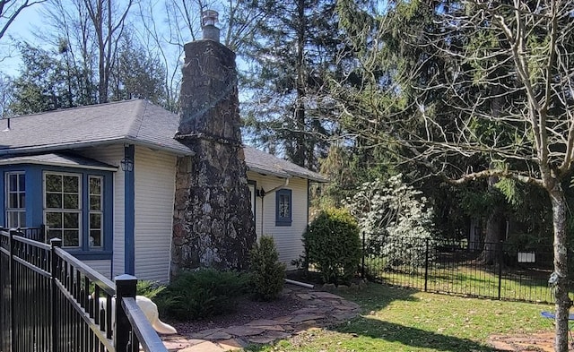 171 Mohawk Trl, Slippery Rock Twp But, PA 16057 - view of side of property featuring fence, a lawn, and roof with shingles