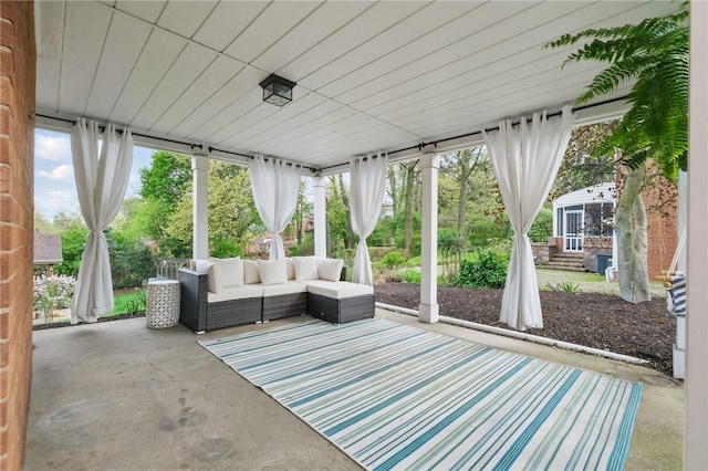 sunroom with an outdoor living space