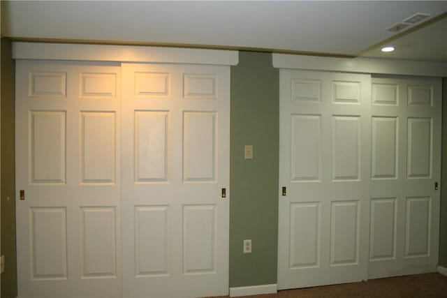 interior space with visible vents, recessed lighting, and baseboards