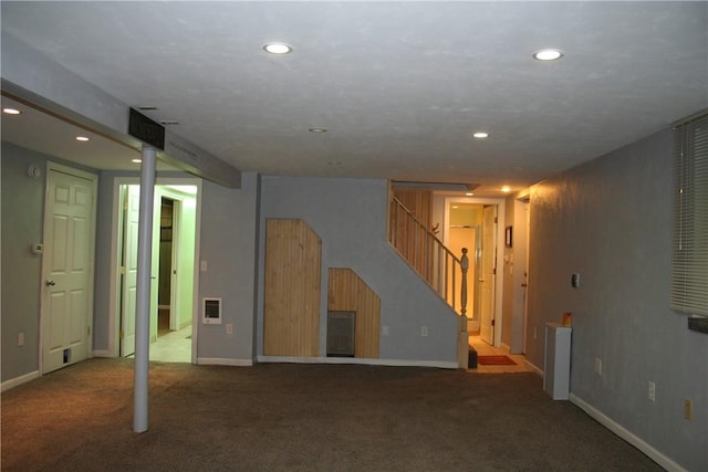 finished basement with recessed lighting, carpet flooring, stairs, and baseboards