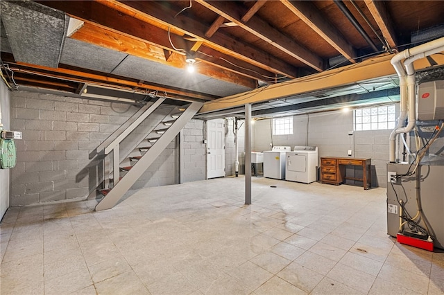 basement featuring independent washer and dryer and stairway