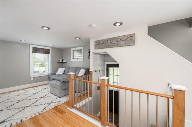 interior space with recessed lighting, baseboards, and wood finished floors