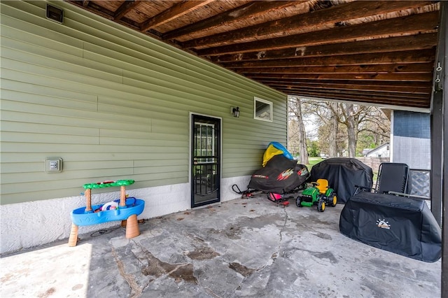 view of patio featuring a grill