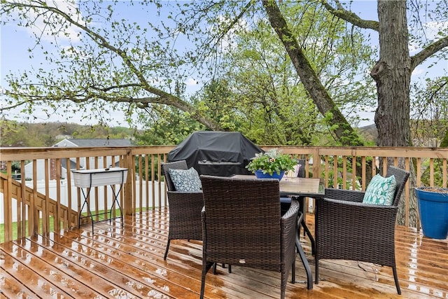 deck featuring outdoor dining area
