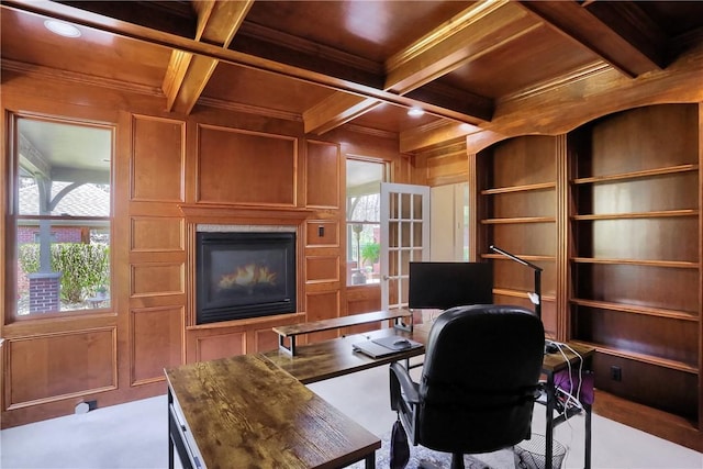 home office with wood ceiling, a glass covered fireplace, and beamed ceiling