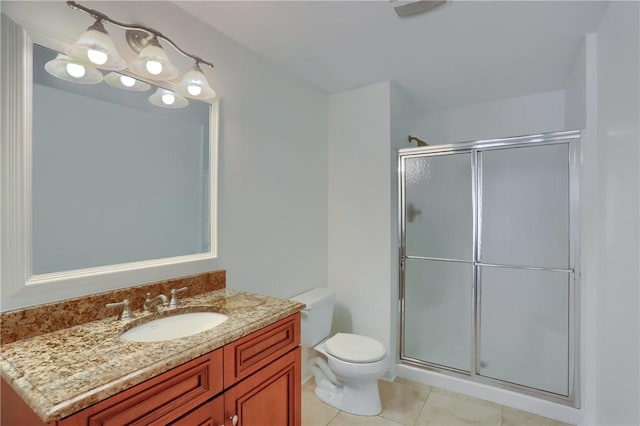 full bath featuring vanity, tile patterned floors, a stall shower, and toilet