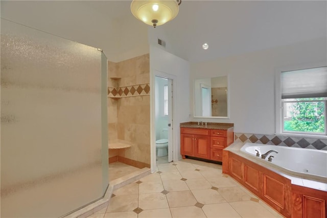 bathroom with visible vents, tile patterned flooring, a tile shower, vanity, and a whirlpool tub