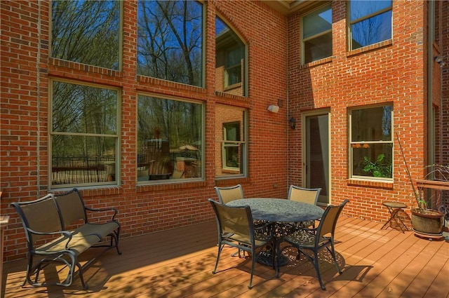 wooden deck featuring outdoor dining space