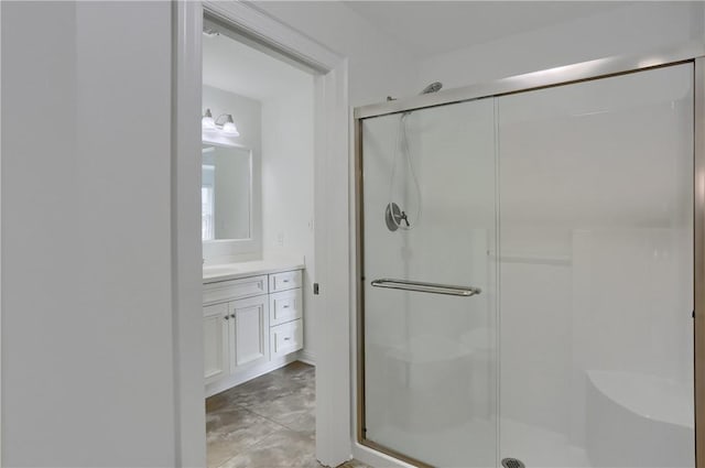 bathroom featuring vanity and a stall shower