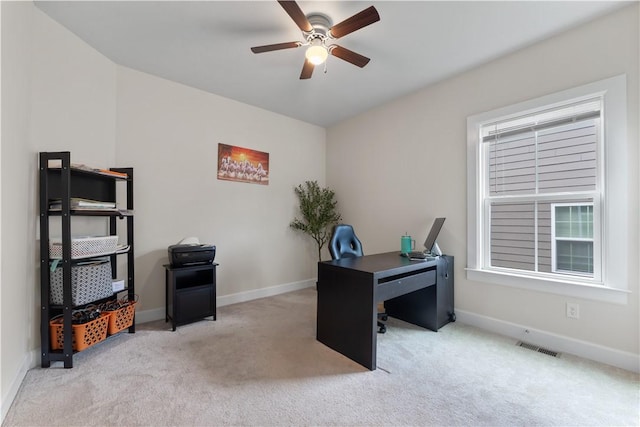 home office with baseboards, ceiling fan, carpet, and visible vents
