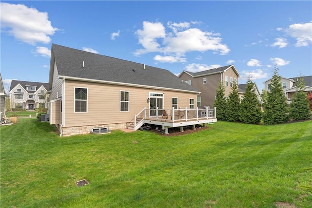 back of house featuring a yard, a deck, and central AC