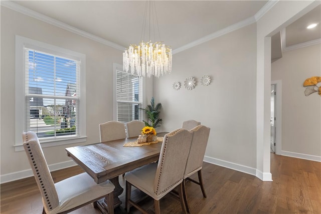 dining room with crown molding and wood finished floors