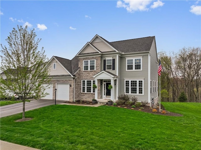 view of front of home featuring driveway, a front yard, a garage, a shingled roof, and stone siding