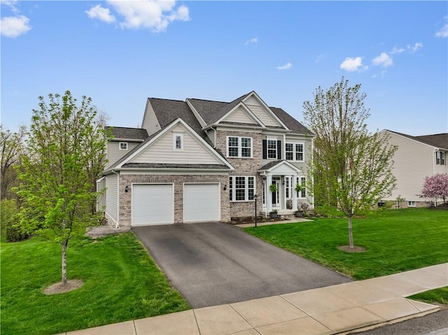 view of front of house with a garage, a front lawn, aphalt driveway, and stone siding