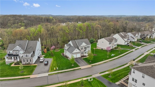 bird's eye view featuring a residential view and a forest view