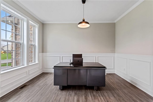 office area with visible vents, dark wood finished floors, a wainscoted wall, ornamental molding, and a decorative wall