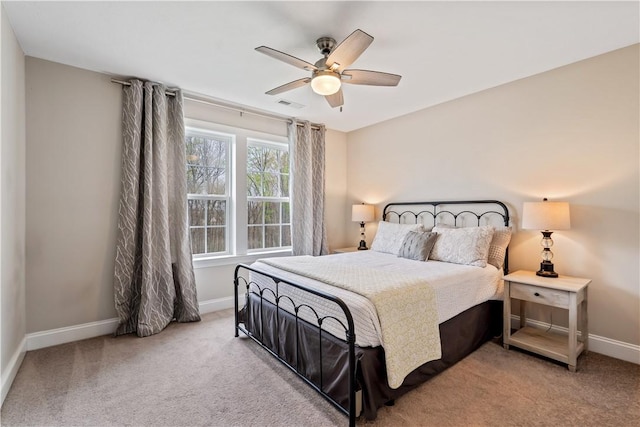 bedroom featuring baseboards, carpet, a ceiling fan, and visible vents