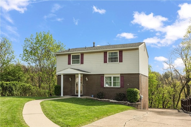 view of front of property with brick siding and a front lawn