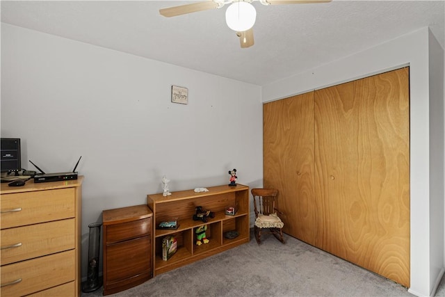 bedroom with ceiling fan and carpet