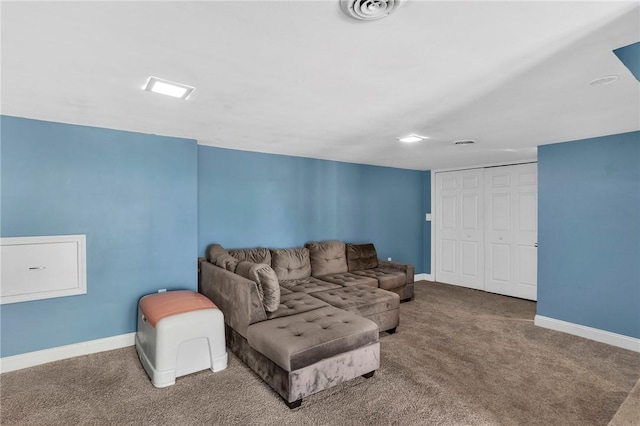 living room with baseboards, carpet flooring, and visible vents