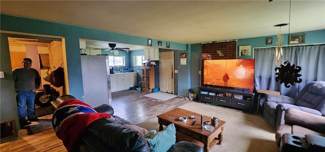 54 Old Dinnerbell Rd, Farmington, PA 15437 - living area with ceiling fan and wood finished floors