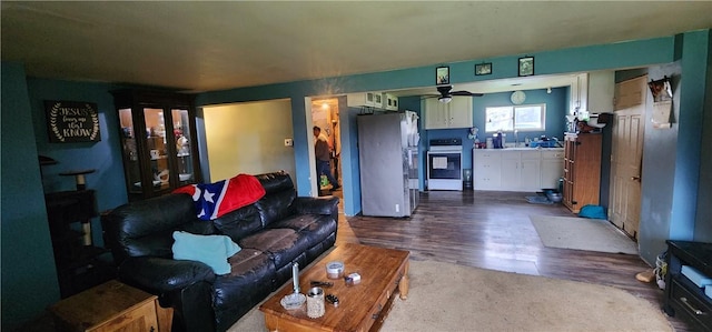 54 Old Dinnerbell Rd, Farmington, PA 15437 - living area with dark wood-style flooring and ceiling fan
