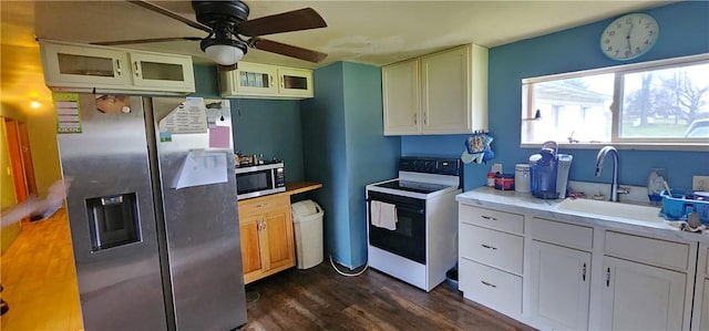 54 Old Dinnerbell Rd, Farmington, PA 15437 - kitchen featuring dark wood-style flooring, ceiling fan, appliances with stainless steel finishes, a sink, and light countertops