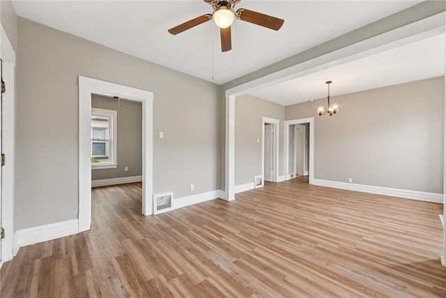 410 Butz St, New Castle/3Rd, PA 16101 - spare room with baseboards, visible vents, ceiling fan with notable chandelier, and light wood-style floors