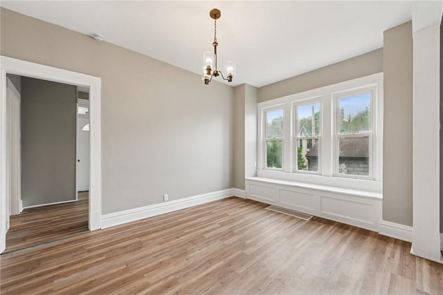 410 Butz St, New Castle/3Rd, PA 16101 - empty room with light wood-style floors, baseboards, visible vents, and a chandelier