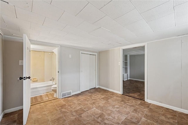 410 Butz St, New Castle/3Rd, PA 16101 - unfurnished bedroom with visible vents, connected bathroom, and baseboards