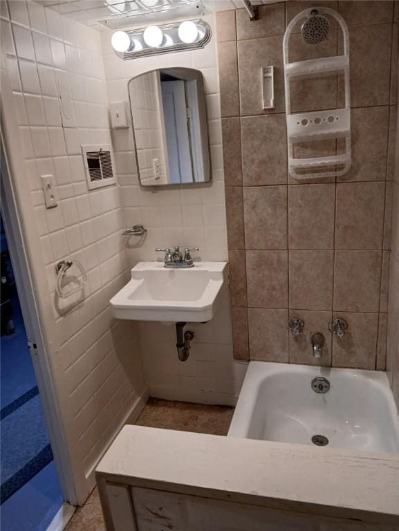 2318 Salisbury St, South Side, PA 15210 - full bath with a sink, tile walls, and shower / tub combination