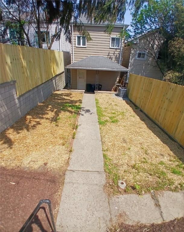 2318 Salisbury St, South Side, PA 15210 - exterior space featuring central AC unit and fence private yard