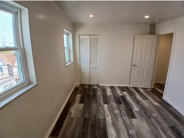 2318 Salisbury St, South Side, PA 15210 - unfurnished bedroom with baseboards, multiple windows, and wood finished floors