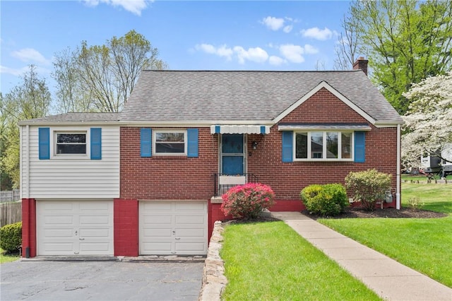 view of front of property featuring roof with shingles, an attached garage, a front lawn, brick siding, and a chimney