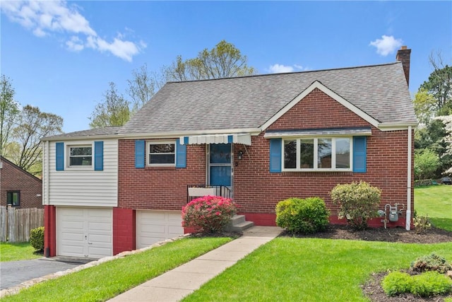 view of front of home featuring driveway, roof with shingles, brick siding, a front lawn, and an attached garage
