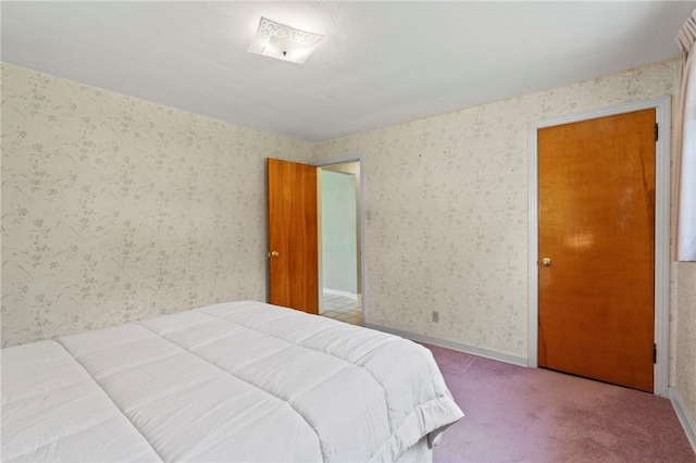 carpeted bedroom with wallpapered walls
