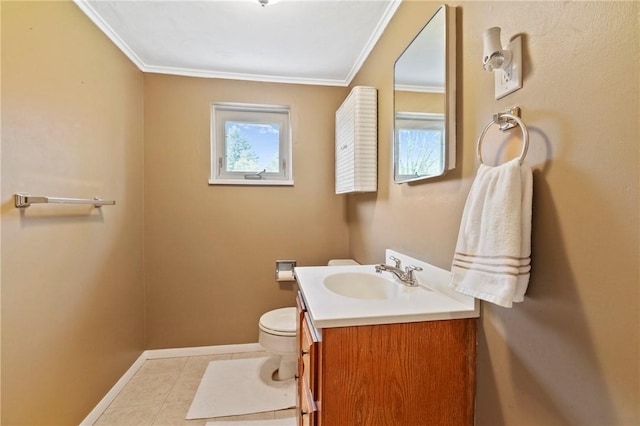 half bathroom with tile patterned flooring, vanity, toilet, baseboards, and ornamental molding