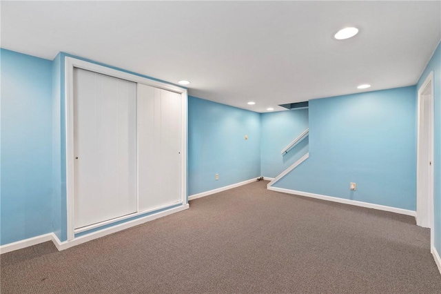 finished below grade area featuring baseboards, carpet flooring, and recessed lighting