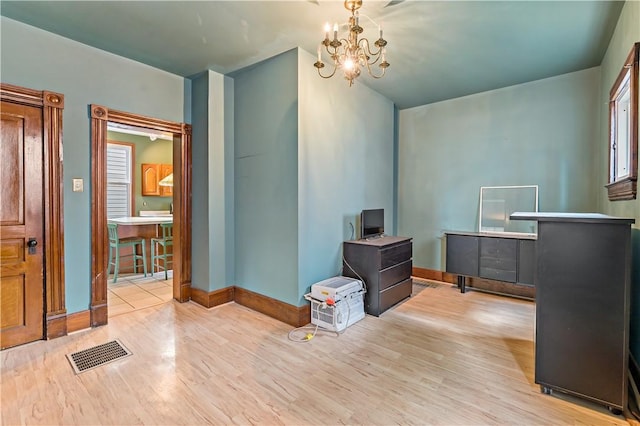 503 Beechwood Ave, Carnegie, PA 15106 - interior space featuring baseboards, a chandelier, wood finished floors, and visible vents