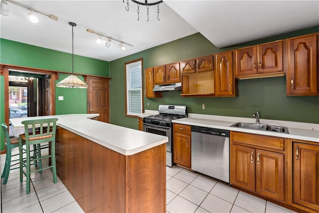 503 Beechwood Ave, Carnegie, PA 15106 - kitchen featuring a sink, light countertops, under cabinet range hood, stainless steel appliances, and light tile patterned flooring